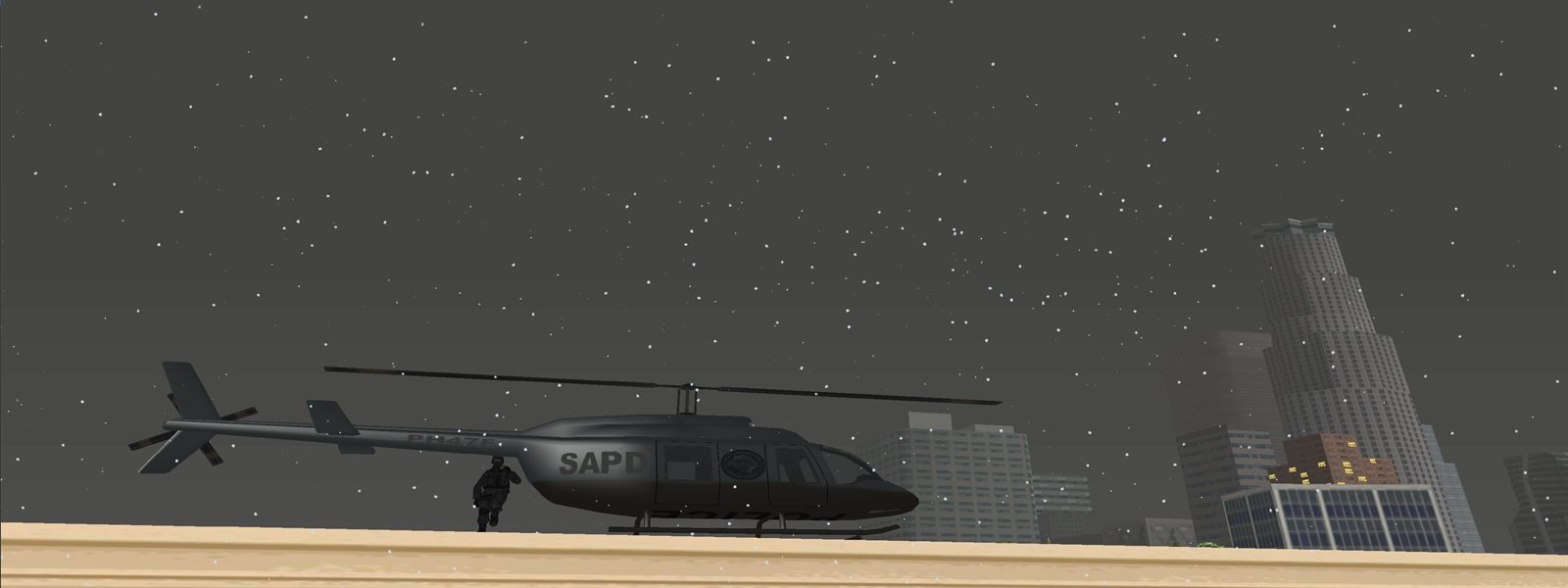 An SAPD helicopter on a rooftop helipad at night